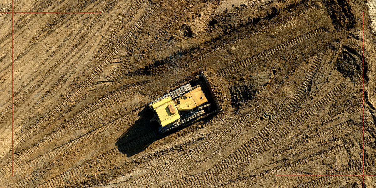 Bulldozer leveling and grading the ground